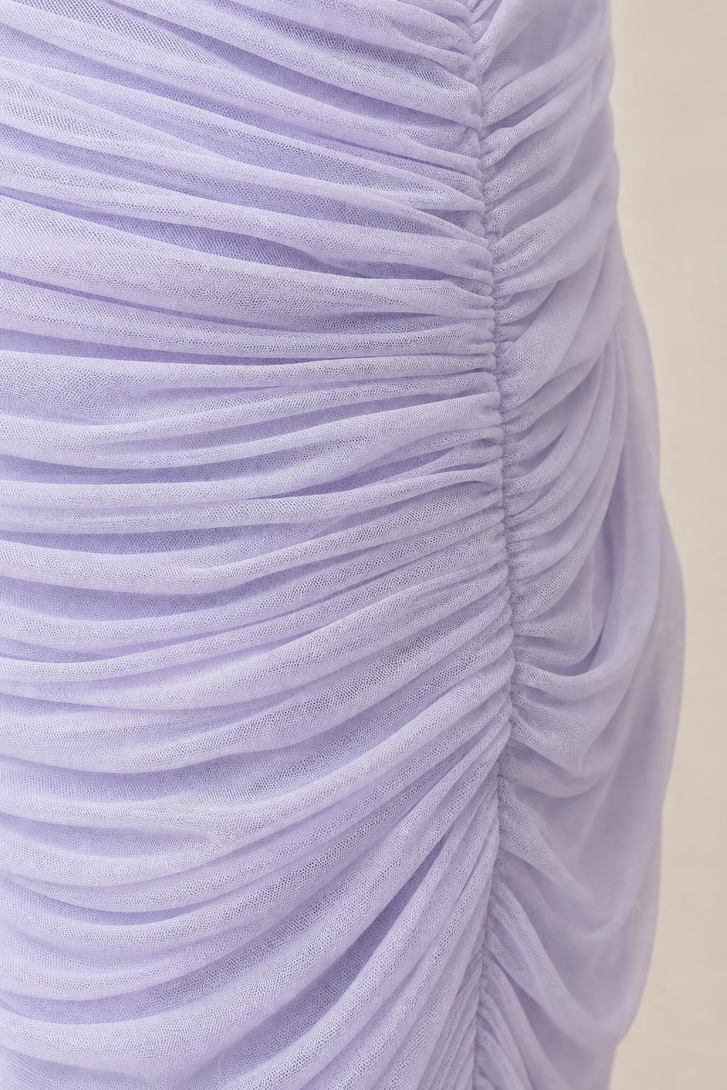 Close-up texture view of fine mesh ruching on lavender dress