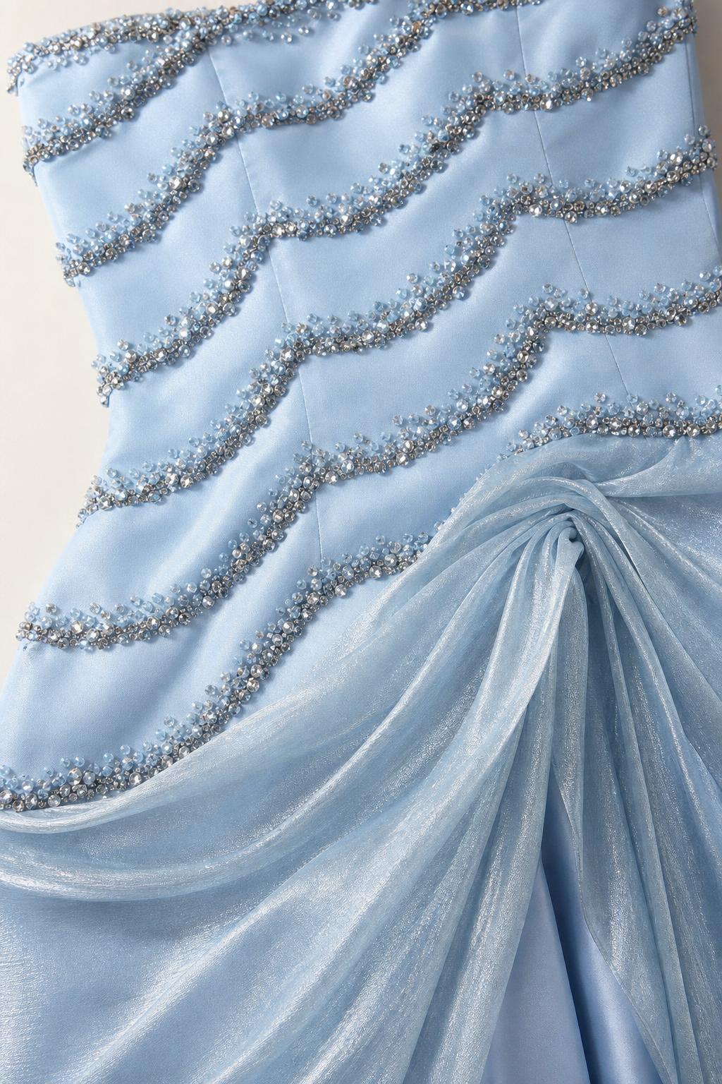 Close-up detail of bodice beadwork and draped organza