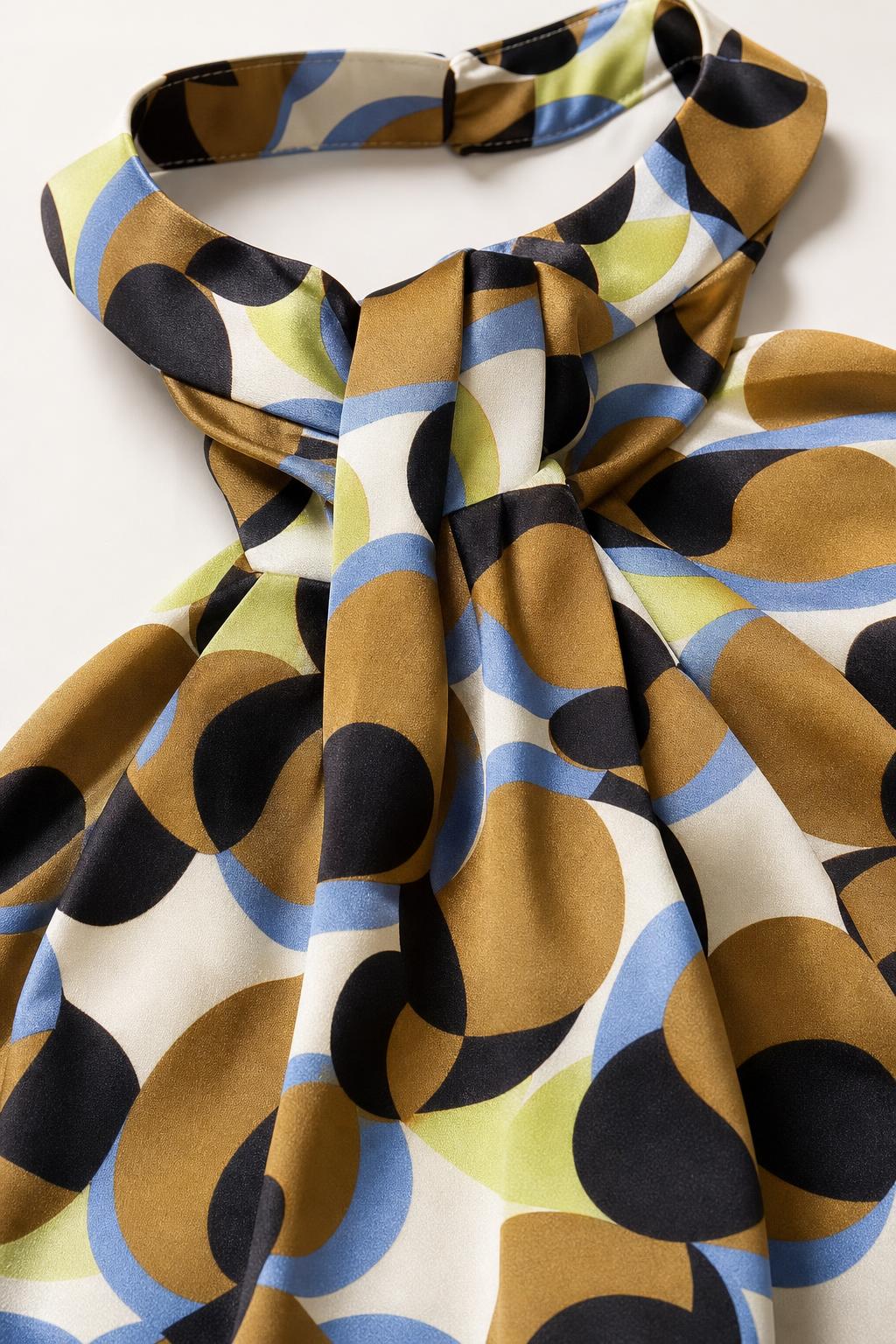 Close up view of halter neck knot and geometric print fabric