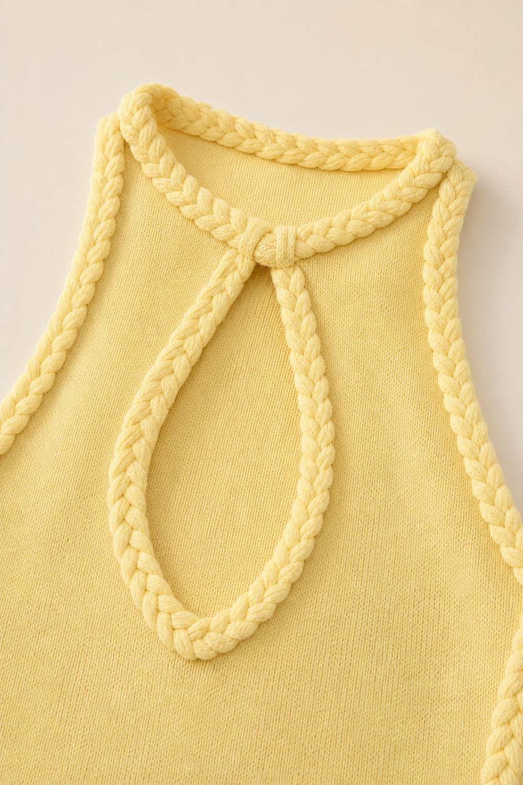 Close-up of braided keyhole neckline detail