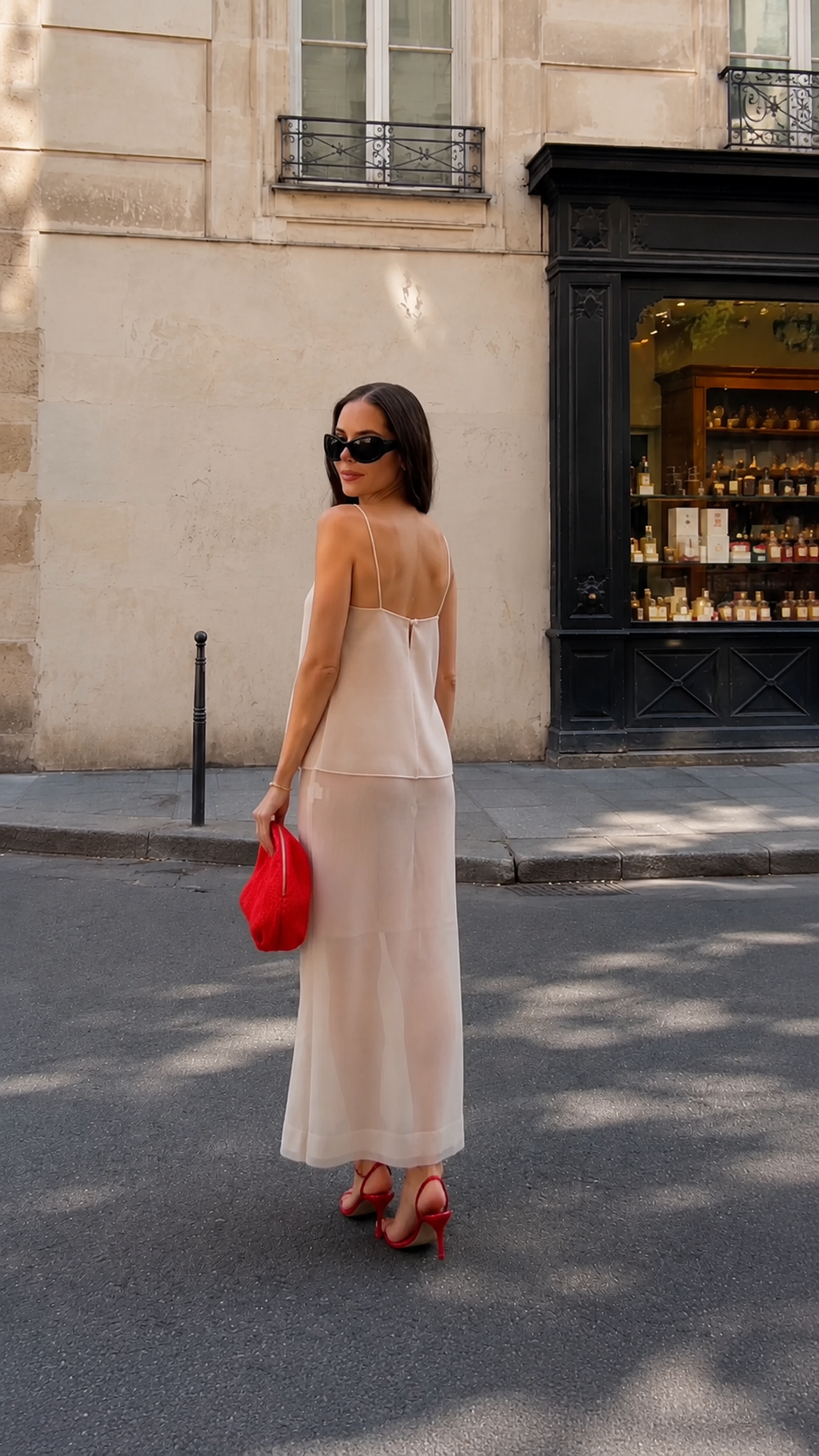 Back view of champagne layered cami maxi dress with slim straps