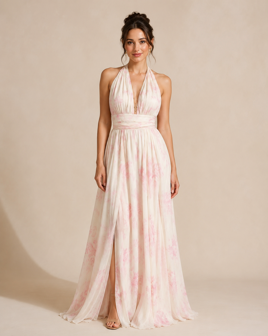Full-length front view of blush floral halter maxi dress with airy pleated skirt