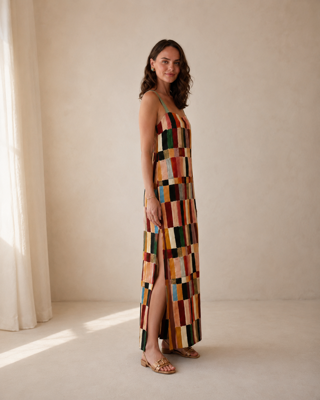 Side view of multicolor patchwork-style maxi dress showing side slit