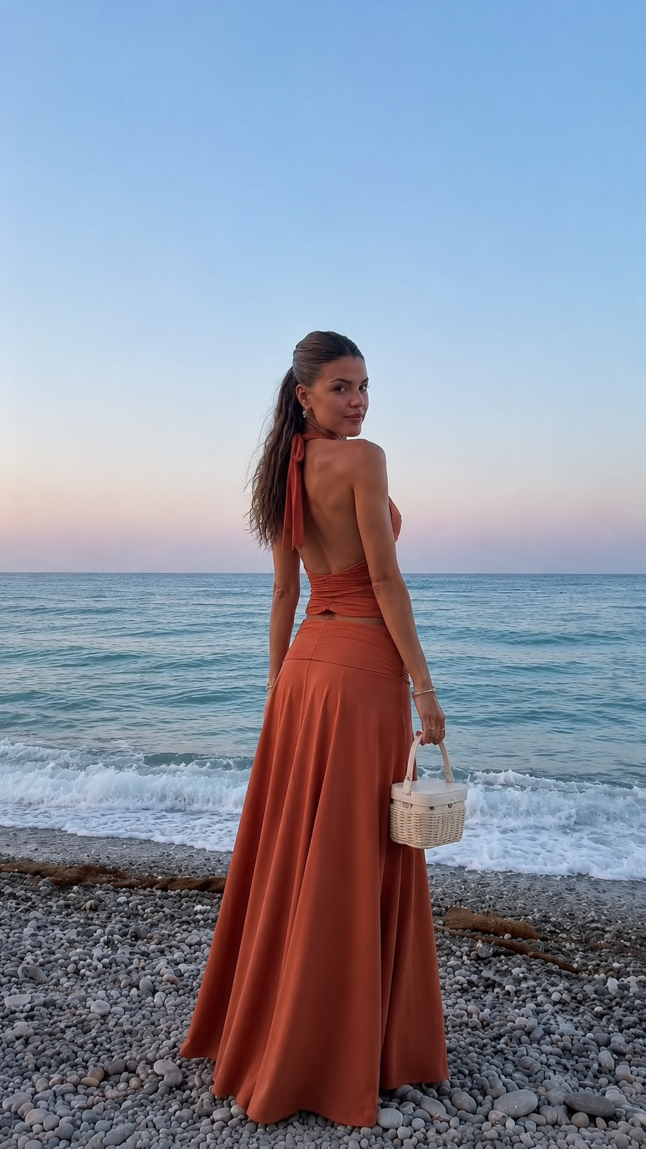 Back view of terracotta backless halter top and maxi skirt set