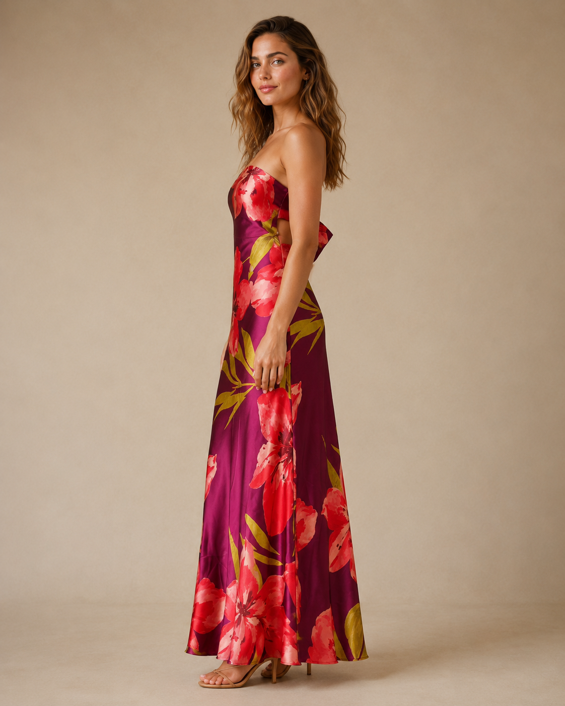 Side view of berry floral strapless satin-look maxi dress with long flowing shape