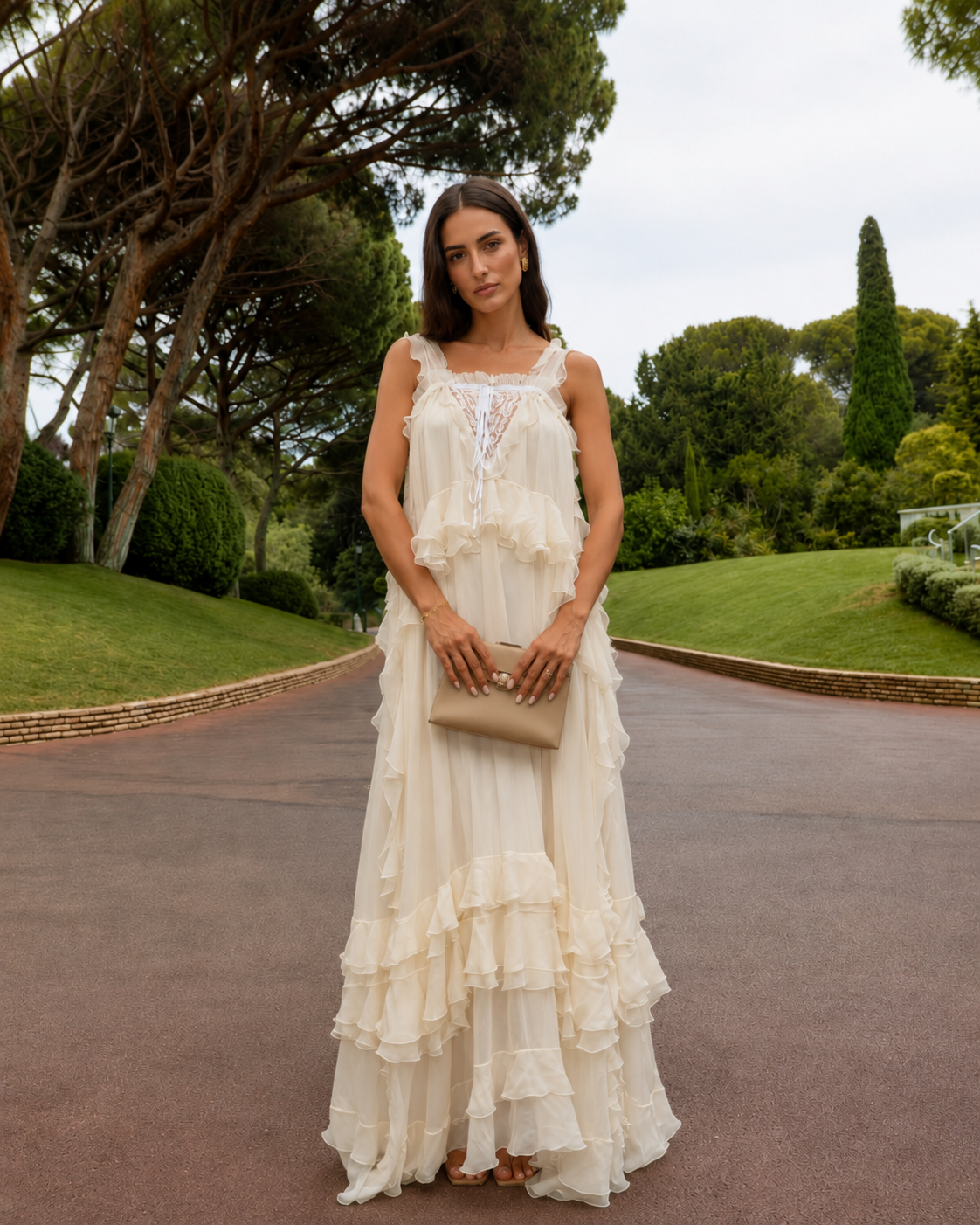 Front view of cream romantic maxi dress with square neckline and tiered finish