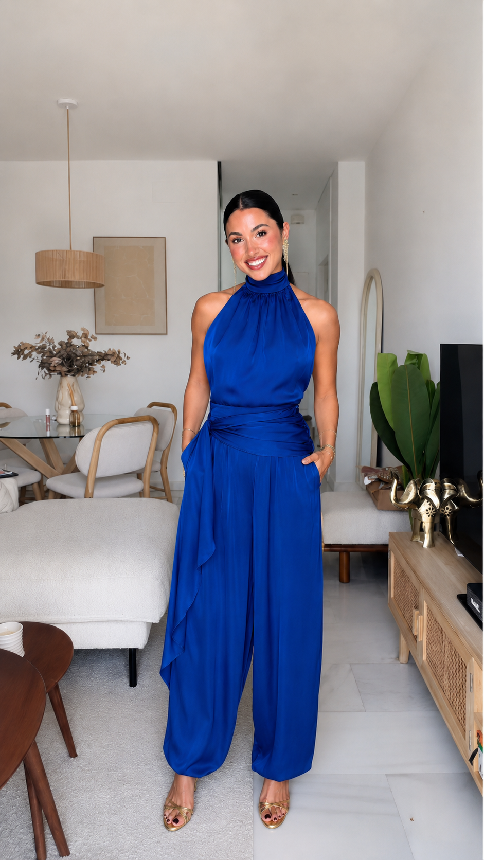 Royal blue halter neck jumpsuit with gathered neckline and draped waist